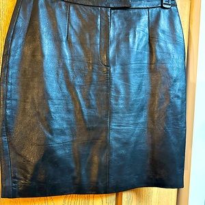 Black leather skirt with zipper in front.